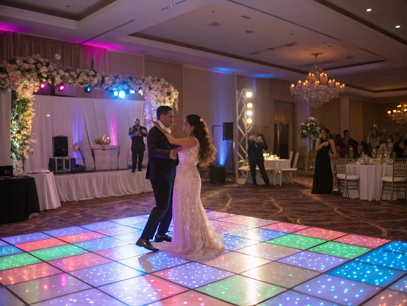 A dynamic shot of a wedding reception with fog effects swirling around the dance floor, creating a magical and ethereal atmosphere, highlighting XirfadTech's fog effects service.